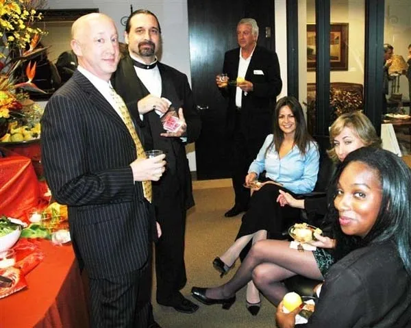 A group of people sitting around at an event.